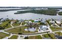 Waterfront community featuring distinct homes with boat docks, scenic waterways, and lush landscaping at 342 Green Dolphin Dr, Placida, FL 33946