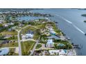 Beautiful coastal neighborhood with waterfront properties, docks, and scenic water views from above at 342 Green Dolphin Dr, Placida, FL 33946