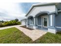 Newly constructed home with attractive curb appeal and landscaped walkway at 8099 Walbert St, Port Charlotte, FL 33981