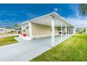 Mobile home with carport and spacious yard at 337 Blackburn Blvd, North Port, FL 34287