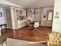 Dining area with round table, chairs and hutch at 6276 Oriole Blvd, Englewood, FL 34224