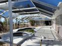 An outside pool area with a covered patio at 12440 Placida Rd, Placida, FL 33946