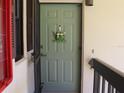 Quaint condo entrance with a welcome sign at 19505 Quesada Ave # F204, Port Charlotte, FL 33948