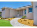 New construction home with a two-car garage and lush lawn at 8343 Olsen St, Port Charlotte, FL 33981