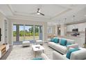 Bright living room features sliding glass doors leading to backyard, and an open floorplan at 8343 Olsen St, Port Charlotte, FL 33981