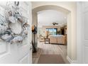 Bright and spacious entryway with a view into the living room at 10601 Lemon Creek Loop # 102, Englewood, FL 34224