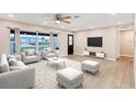 Living room with light flooring, neutral walls, and ample natural light at 76 Caddy Rd, Rotonda West, FL 33947