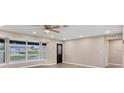 Living room featuring a large window and a view of the street at 76 Caddy Rd, Rotonda West, FL 33947