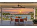 Spacious deck overlooking the water with sunset views, seating for four at 13330 Anglers Way, Placida, FL 33946