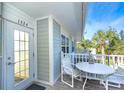 Small balcony with table and chairs, offering a relaxing outdoor space at 7536 Palm Island S Dr # 1524, Placida, FL 33946