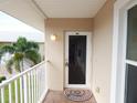 Condo entry with private balcony and exterior door at 9600 Fiddlers Green Cir # 212, Rotonda West, FL 33947