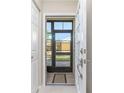 Screened entryway with tiled flooring and door at 6796 Gasparilla Pines Blvd # 95, Englewood, FL 34224