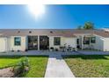 Two-unit building with landscaping and bike at 6796 Gasparilla Pines Blvd # 95, Englewood, FL 34224