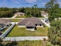 Aerial view of house, backyard, and surrounding neighborhood at 5290 Globe Ter, North Port, FL 34286