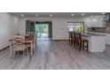 Open concept dining area with wood flooring and kitchen access at 578 Lomond Dr, Port Charlotte, FL 33953