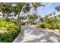 Coastal home with palm trees and gravel driveway at 201 Kettle Harbor Dr, Placida, FL 33946