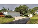 Two-car garage with additional detached single car garage at 110 S Oxford Dr, Englewood, FL 34223