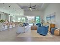 Spacious living room with open floor plan and pool view at 8250 Arlewood Cir, Port Charlotte, FL 33981