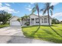 Single-Gathering home with two-car garage and landscaping at 26021 Templar Ln, Punta Gorda, FL 33983