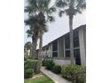 Condo building with palm trees and walkway at 1515 Forrest Nelson Blvd # A208, Port Charlotte, FL 33952