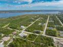 Beautiful aerial view of the property, showcasing the home and surrounding landscape near the water at 5039 Parker St, Port Charlotte, FL 33981