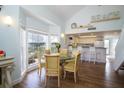 Bright dining area with glass-top table and four chairs at 7486 Palm Island Dr # 2422, Placida, FL 33946