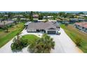 Aerial view of waterfront home with boat lift and RV parking at 245 Spaniards Rd, Placida, FL 33946