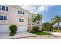 Two-story townhome with attached garage and lush landscaping at 10309 Coral Landings Ct # 101, Placida, FL 33946