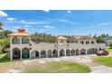 Mediterranean style home with terracotta roof and multiple garages at 14234 River Beach Dr, Port Charlotte, FL 33953