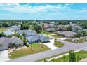 An aerial view of a residential neighborhood, highlighting a single-Gathering home with a flag at 254 Orlando Blvd, Port Charlotte, FL 33954
