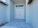 Front entry with double doors and tiled flooring at 2170 Doolittle Ln, Port Charlotte, FL 33953