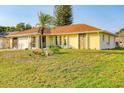 Front view of a single-story house at 285 Mark Twain Ln, Rotonda West, FL 33947