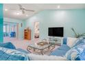 Bright living room with light blue walls at 285 Mark Twain Ln, Rotonda West, FL 33947