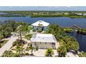 An aerial view of the home and surrounding waterfront area at 13074 Via Flavia, Placida, FL 33946