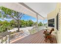 Relaxing front porch with rocking chair and views of the neighborhood at 13074 Via Flavia, Placida, FL 33946