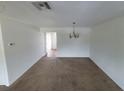 Dining room with chandelier and access to other rooms at 22481 Westchester Blvd # B35, Punta Gorda, FL 33980