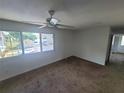 Bright bedroom with large window and ceiling fan at 22481 Westchester Blvd # B35, Punta Gorda, FL 33980