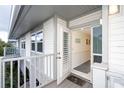 Covered balcony with access to an interior hallway and featuring a white railing at 7104 Palm Island Dr # Le38, Placida, FL 33946