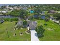 Waterfront home boasting lush landscaping and a private dock at 2516 Dixon Ter, Port Charlotte, FL 33981
