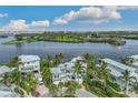 Waterfront property aerial view, showcasing the home and surrounding area at 13310 Anglers Way, Placida, FL 33946