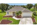 One-story house with a large yard and driveway, aerial view at 26156 La Paz Ct, Punta Gorda, FL 33983