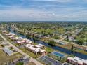 Aerial view of condo community near canal and golf course at 78 Boundary Blvd # 192, Rotonda West, FL 33947