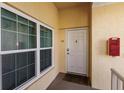 Unit entryway with door and windows at 8409 Placida Rd # 308, Placida, FL 33946