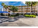 Exterior of multi-story building with parking area at 8409 Placida Rd # 308, Placida, FL 33946