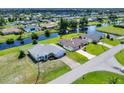 Aerial view of two houses near a canal at 189 Bunker Rd, Rotonda West, FL 33947