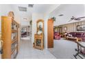 Bright and spacious entryway with built-in shelving and views to the living room at 1867 Neptune Dr, Englewood, FL 34223