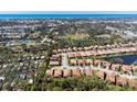 Panoramic aerial view showcasing the property's location within a lush residential neighborhood near the water at 1012 Bradberry Dr, Nokomis, FL 34275