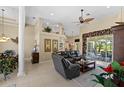 Spacious living room with a sectional sofa and access to a patio at 14089 Newson Ln, Port Charlotte, FL 33981