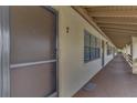 Building hallway with doors to individual units at 6 Quails Run Blvd # 7, Englewood, FL 34223