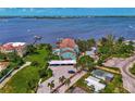 Aerial view showing waterfront property, pool, and parking at 53 W Bay Heights Rd # 205, Englewood, FL 34223